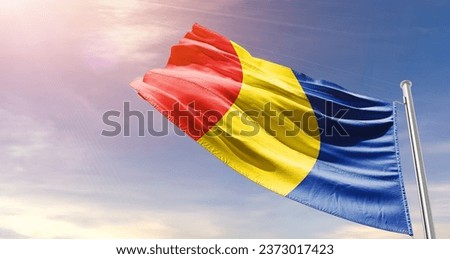 Romania national flag waving in beautiful sky. The flag waving with dynamic angle.