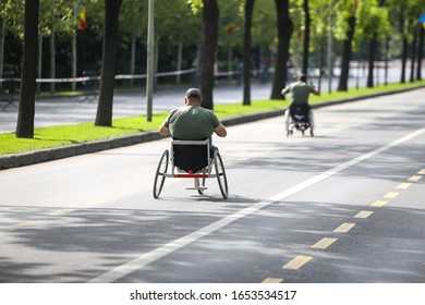 Romanian Army Veteran Soldiers, Injured And Disabled, Sitting In Wheelchairs.