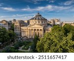 Romanian Atheneum in Bucharest during a summer sunset. Aerial view of this amazing landmark historical building from Bucharest, Romania, on Victoriei Avenue (Calea Victoriei). Travel to Romania.