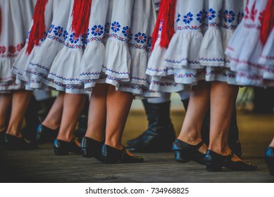 Romanian Dancers In Traditional Costume, Perform A Folk Dance.