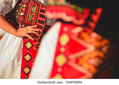 Romanian Dancers In Traditional Costume, Perform A Folk Dance.