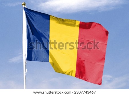 Romanian flag in the cloudy sky. waving in the sky