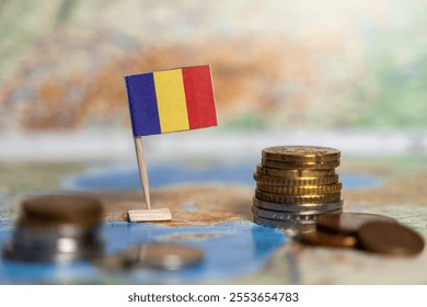 romanian flag and coins on a world map, economy concept, focus on finance and trade, symbolizing money, investment, and wealth - Powered by Shutterstock