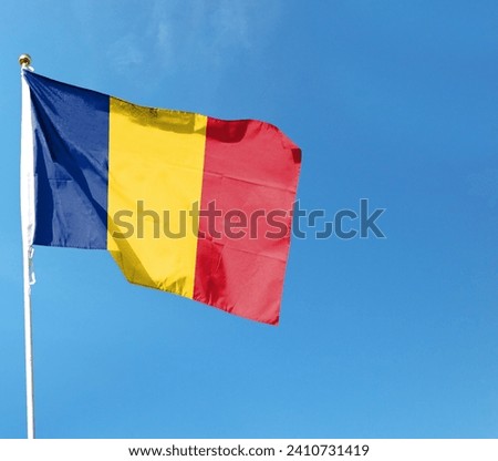 Romanian flag on cloudy sky. flying in the sky
