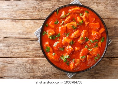 Romanian Ostropel Chicken with Garlicky Tomato Gravy closeup in the plate on the table. Horizontal top view above - Shutterstock ID 1935984733