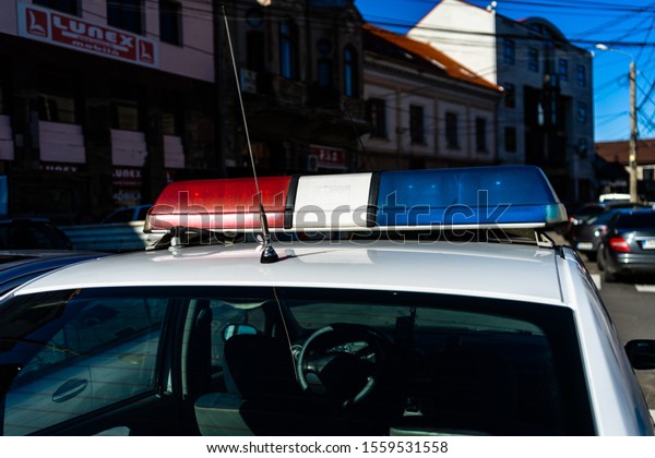 Romanian police car on the\
streets of Bucharest.  Flashing lights of police car. Bucharest,\
Romania, 2019.