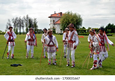 Romanians during the Whitsuntide festivities wearing traditional rustic clothes - colorful dance tradition called "calus" - Dragasani, Dolj / Romania - 5/28/2018
