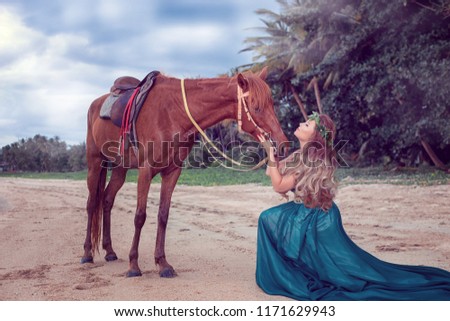 Romanic woman walking and riding horse on the beach in sunset time 