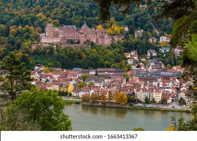 Romantic Aerial Panoramic View Of Heidelberg's Castle Ruin On Königstuhl Hill, The Old Town And The Neckar River Seen From The Philosopher’s Path In Autumn.