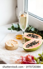 Romantic Authentic Home Indoor Picnic, Champagne Glass, Papaya, Camembert Cheese, Jamon And Nuts, Eucalyptus Branch