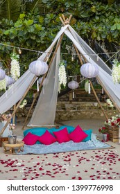 Romantic Beach Setting With Blue And Pink Cushion Pillows Rug Bamboo Structure Love Concept No People