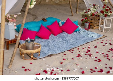 Romantic Beach Setting With Blue And Pink Cushion Pillows Rug Bamboo Structure Love Concept No People