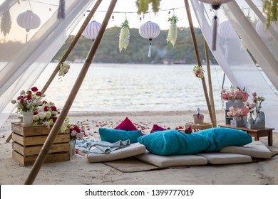 Romantic Beach Setting With Blue And Pink Cushion Pillows Rug Bamboo Structure Love Concept No People