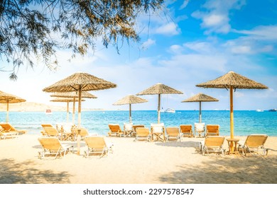 Romantic beach with sunbeds at greek island, Paros Greece