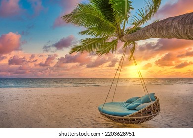 Romantic beach sunset. Palm tree with swing hanging before majestic clouds sky. Dream nature landscape, tropical island paradise, couple destination. Love coast, closeup sea sand. Relax pristine beach - Shutterstock ID 2203628951