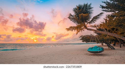 Romantic beach sunset. Palm tree with swing hanging before majestic clouds sky. Dream nature landscape, tropical island paradise, couple destination. Love coast, closeup sea sand. Relax pristine beach - Shutterstock ID 2267351809