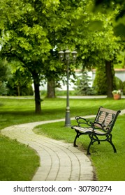 romantic bench in peaceful park in spring