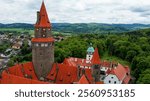 Romantic Bouzov Castle standing near Olomouc in the Czech Republic. A beautiful fairytale castle in the light of the setting sun.