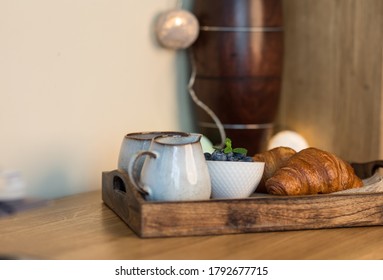 romantic breakfast with fresh croissants coffee,milk and berries on wooden table - Shutterstock ID 1792677715