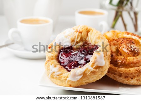 Romantic breakfast setup with Danish pastries and coffee 商業照片 © 