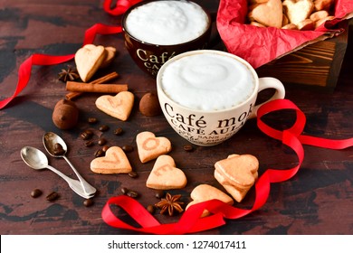 romantic Breakfast: two cups of coffee and cookies in the shape of hearts, on the cookie letters LOVE. the concept of a gift for Valentine's day on February 14. selective focus - Shutterstock ID 1274017411