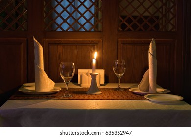 Romantic candle light dinner in a restaurant.