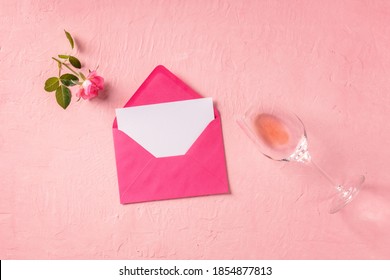 Romantic Card, Valentine Or Invitation Mockup, A Flat Lay With A Pink Rose And Rose Wine, Overhead Flat Lay Shot