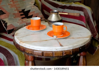Romantic coffee table, two cups of coffee on a marble table.