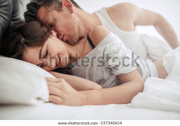 Romantic Couple Bedroom Enjoying Sensual Foreplay Stock