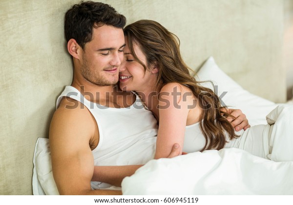 Romantic Couple Cuddling On Bed Bedroom Stockfoto Jetzt