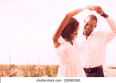 Romantic Couple Dancing And Smiling Outside In The Garden