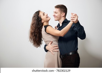 Romantic Couple Dancing Tango On White Background