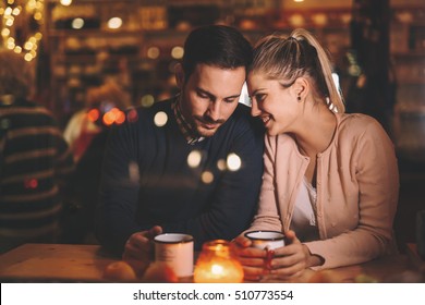 Romantic Couple Dating At Night In Pub