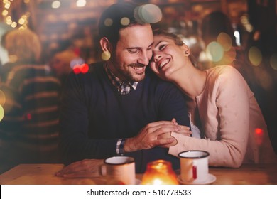 Romantic Couple Dating In Pub At Night