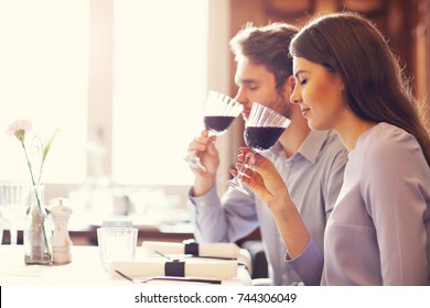 Romantic couple dating in restaurant - Shutterstock ID 744306049