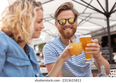 romantic couple drinking beer with artistic lens flare - Powered by Shutterstock