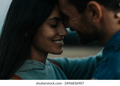 Romantic couple embracing each other and smiling. Close up portrait of a couple in love - Powered by Shutterstock