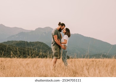 A Romantic Couple Embracing Each Other in a Scenic, Breathtaking Mountain Landscape - Powered by Shutterstock