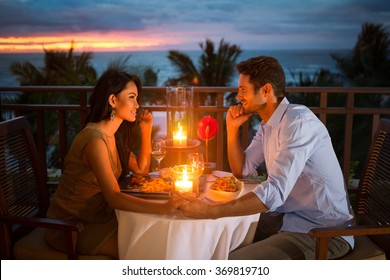 Romantic couple have dinner with sunset and candlelight outdoor, concept love, relationship and romantic 