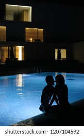 Romantic Couple Kissing At The Pool In The Night - Natural Light