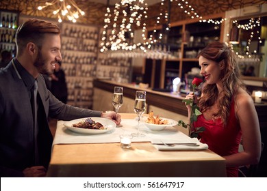 Romantic Couple In Love Have Dinner On ValentineÃ¢??s Evening In Restaurant