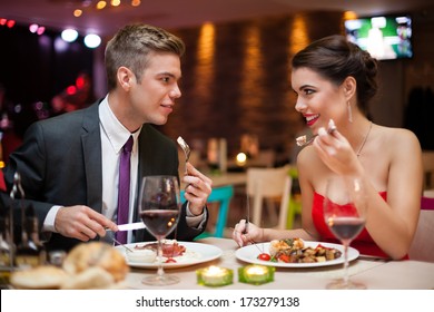 Romantic Couple In Love On Dinner In Restaurant