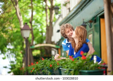 Romantic Couple On The Balcony Of Their House Or Hotel