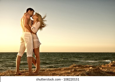 Romantic couple on the beach - Powered by Shutterstock