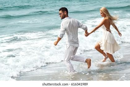 Romantic Couple On The Beach