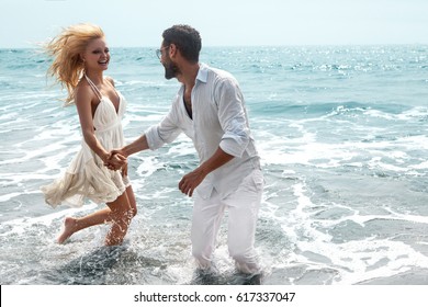 Romantic Couple On The Beach