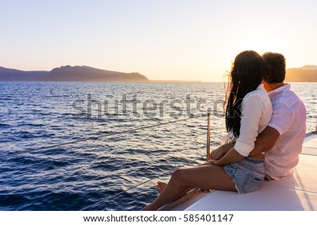 Romantic couple on yacht at sunset