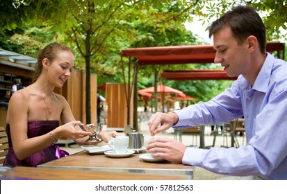 Romantic Couple In Paris Having Breakfast In A Parisian Street Cafe