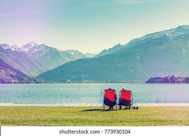 People Red Adirondack Chairs On Green Stock Photo (Edit Now) 768743188