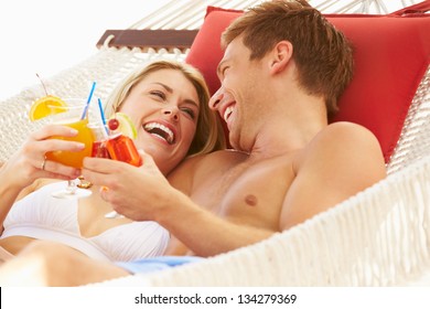 Romantic Couple Relaxing In Beach Hammock